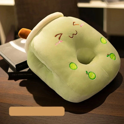 A cute grinning boba milk tea pillow with a center hole and two side holes.
