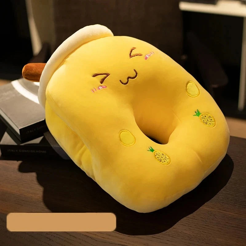 A cheesy grinning yellow pineapple bubble fruit tea plushie pillow with a large center hole for face down sleeping.
