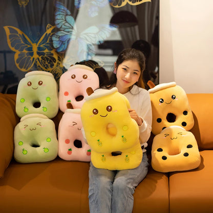 The photo displays a girl sitting on a couch with eight bubble tea pillows, holding the yellow pineapple bubble fruit tea in your hands.