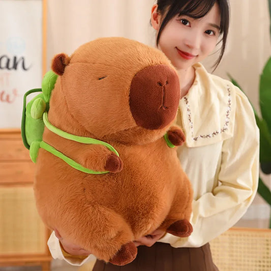 An image depicting a lady holding a large plushie capybara with a green tortoise backpack.