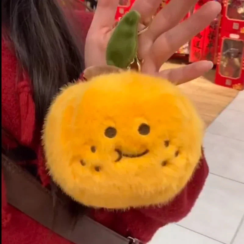 Peelable Orange Plushie with Five Orange Emoji Segments Inside