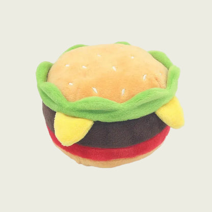 Plush toy shaped like a cheeseburger on a white background