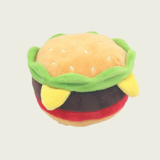 Plush toy shaped like a cheeseburger on a white background