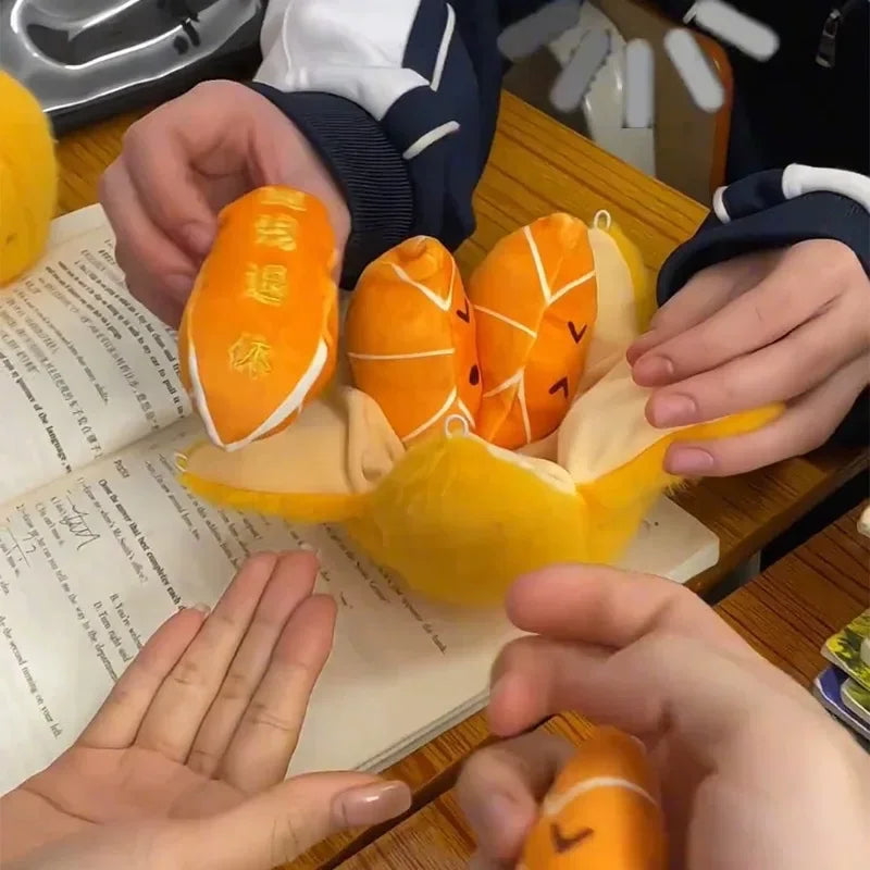 Peelable Orange Plushie with Five Orange Emoji Segments Inside